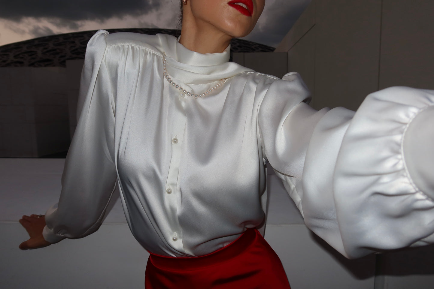 Blouse with accent shoulders and long sleeves with cuffs
